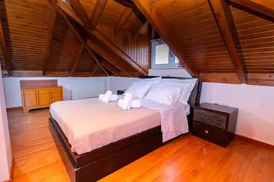 a bedroom with a bed with towels on it at Casa della Pace in Ialyssos