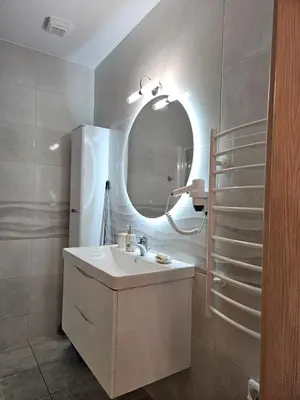 a bathroom with a sink and a mirror at Nereides Apartments Rhodes in Kremasti