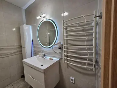 a bathroom with a sink and a mirror at Nereides Apartments Rhodes in Kremasti