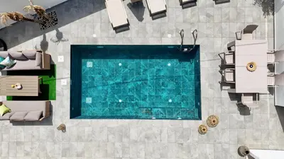 an overhead view of a swimming pool in a house at Melia Casa in Rhodes Town