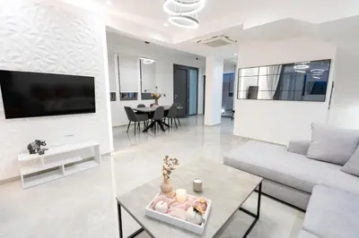 a living room with a couch and a table at Villa Pasadra in Afantou