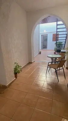 a room with a table and chairs on a tiled floor at Isola Studio 1 in Rhodes Town