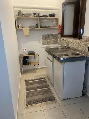 a kitchen with a sink and a dishwasher at Isola Studio 1 in Rhodes Town