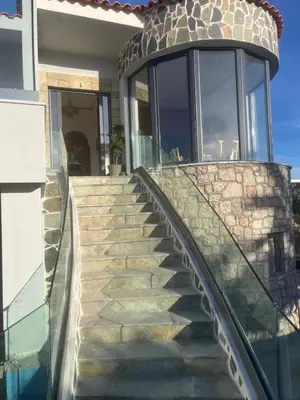 a staircase leading to a house with a window at Villa Eleni-Gennadi in Yennadhion