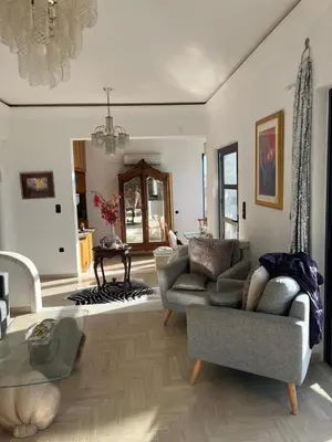 a living room with a couch and a table at Villa Eleni-Gennadi in Yennadhion