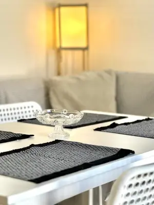 a table with a glass plate on top of it at Stone Steps Studio in Symi