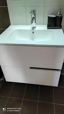 a white sink with a faucet in a bathroom at M&K house in Rhodes Town