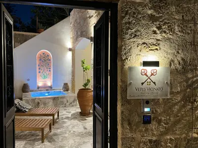 a entrance to a villa with a sign on the door at Vetus Vicinato Luxury Homes in Rhodes Town