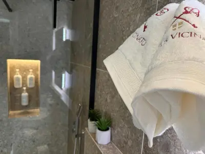 a bathroom with a roll of toilet paper and a towel at Vetus Vicinato Luxury Homes in Rhodes Town