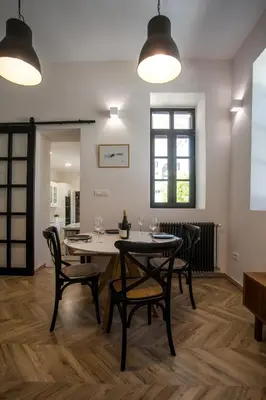 a dining room with a table and chairs at Villa Lou in Rhodes Town