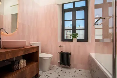 a bathroom with a sink and a toilet and a tub at Villa Lou in Rhodes Town