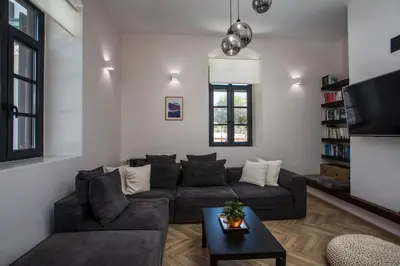 a living room with a couch and a table at Villa Lou in Rhodes Town