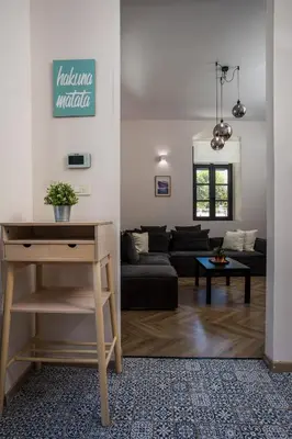 a living room with a couch and a table at Villa Lou in Rhodes Town
