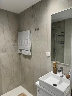 a bathroom with a sink and a mirror at Cozy City Center Apartment B in Rhodes Town