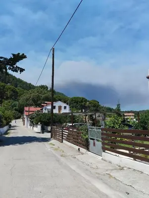 an empty street with a fence and a pole at Casa Marina in Archipolis