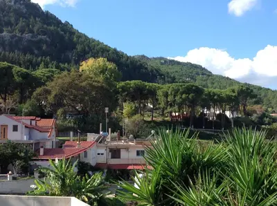 a village in front of a mountain at Casa Marina in Archipolis