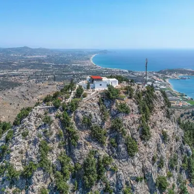 an island with a lighthouse on top of a mountain at Anasa Rustic Villa in Kolimbia