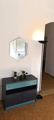 a mirror on top of a dresser in a room at Pap's House in Rhodes Town