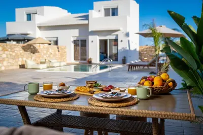 a wooden table with food on top of a house at Amora Pool Villas in Gennadi
