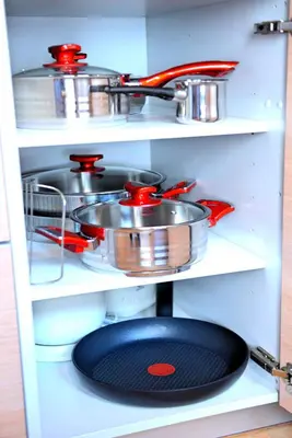 a shelf with many pots and pans on it at Residenza Maria Lindos Villa in Líndos