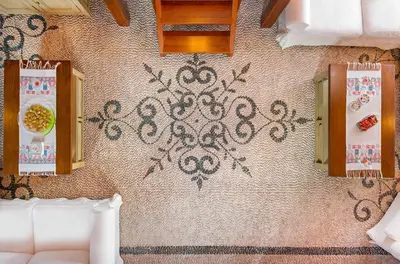 a bedroom with a wall with a design on it at Residenza Maria Lindos Villa in Líndos