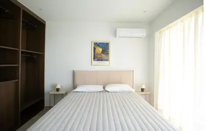 a bedroom with a large white bed in a room at Mairyloy city luxury apartment in Rhodes Town