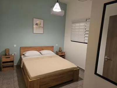 a bedroom with a bed in a room at Filoxenia house in Kremasti