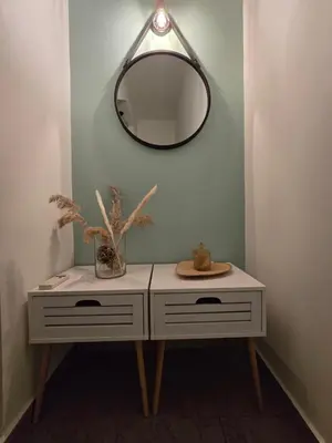 a white dressing table with a mirror on a wall at Filoxenia house in Kremasti
