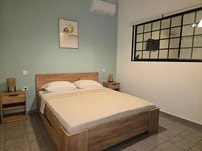 a bedroom with a bed and a window at Filoxenia house in Kremasti