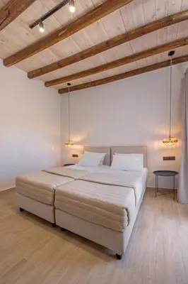 a bedroom with a large bed in a room at Casa di Marillia in Archangelos
