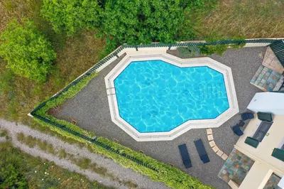 an overhead view of a swimming pool at a resort at Anastasia Veranna Villa in Lachania