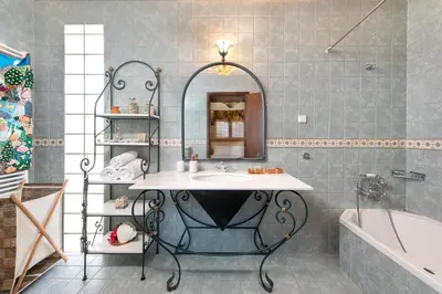 a bathroom with a sink and a tub at Anastasia Veranna Villa in Lachania