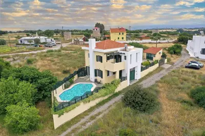 an aerial view of a house with a swimming pool at Anastasia Veranna Villa in Lachania