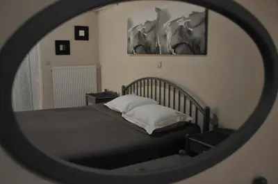 a bedroom with a bed in a mirror at Olive Private Villa Swimming Pool 5 BDR Kolymbia Rhodes in Kolimbia