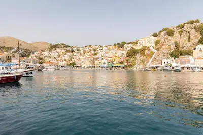 a view of a harbor with boats in the water at Kampos House in Symi
