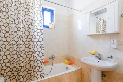 a bathroom with a shower and a sink at Villa Elysium in Kalathos