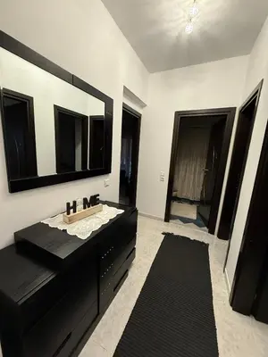 a bathroom with a sink and a large mirror at Katsaras House 3 Cozy Bedrooms in Kremasti