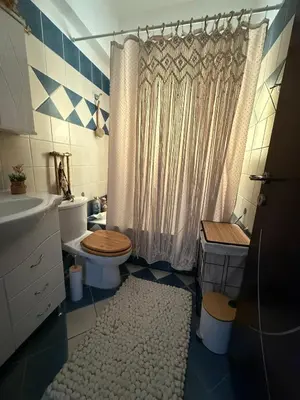 a bathroom with a toilet and a shower at Katsaras House 3 Cozy Bedrooms in Kremasti