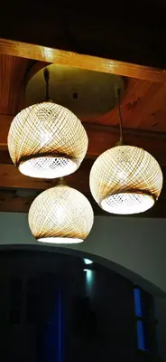 a group of lights hanging from a ceiling at Duchess House in Symi