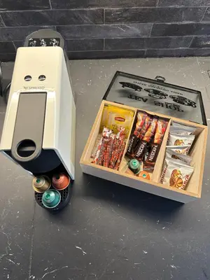 a box with a game system on a table at Nice n Cosy Apartment II in Rhodes Town