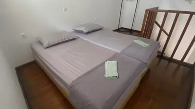 a large bed in a room with at Isola Studio 2 in Rhodes Town