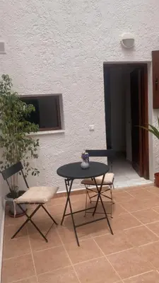 a patio with a table and two chairs at Isola Studio 2 in Rhodes Town