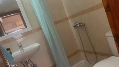 a bathroom with a shower and a toilet and a sink at Isola Studio 2 in Rhodes Town