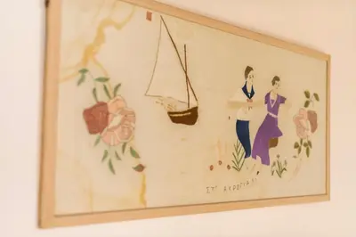 a framed picture of two women on a wall at Mary's house Lindos in Líndos