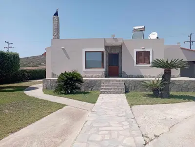 a house with a stone walkway in front of it at Katavias House in Kattavía