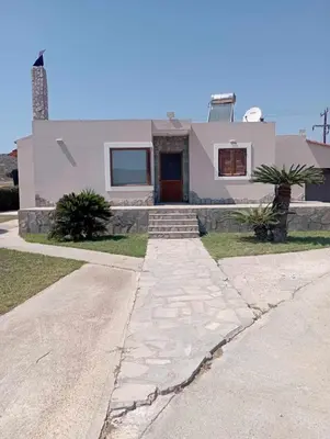 a white house with a pathway in front of it at Katavias House in Kattavía