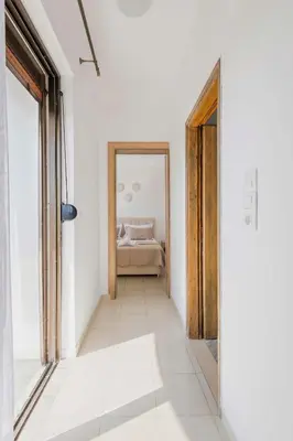 a hallway with a door leading to a bedroom at Villa Bella Natura in Afantou