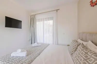 a bedroom with a bed with two towels on it at Villa Bella Natura in Afantou