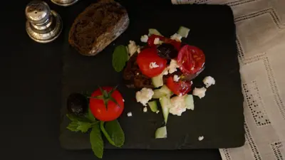 a plate of food with tomatoes and vegetables on it at Kókkini Porta Rossa in Rhodes Town