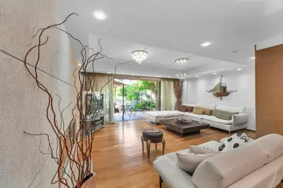 a living room with two couches and a table at Veranna Lux Apartment in Ialyssos
